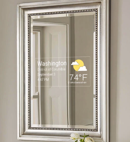 Mirror Feeds on a bathroom silver-framed TV on a plain wall in Qatar.